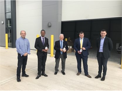 Welsh Minsiters with Council Staff standing in building