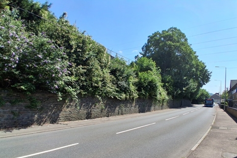 Repairs to large wall structure on main road through Upper Boat
