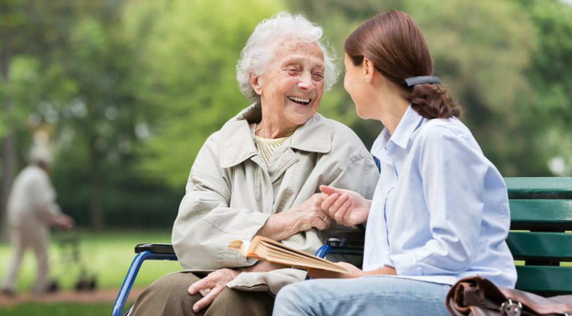 Social worker with happy resident