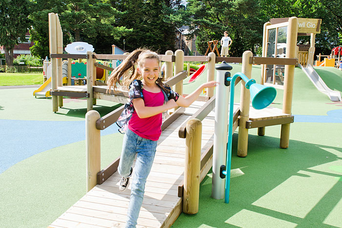 kid-running-on-play-equipment